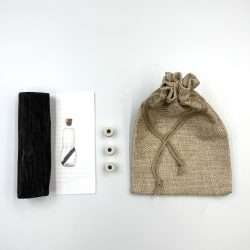 set qui présente 1 baton de binchotan + perles de céramique EM