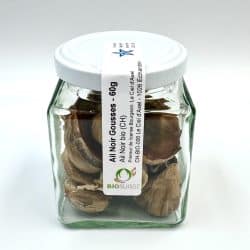 Ail Noir Bio Suisse présenté en gousses dans un pot en verre